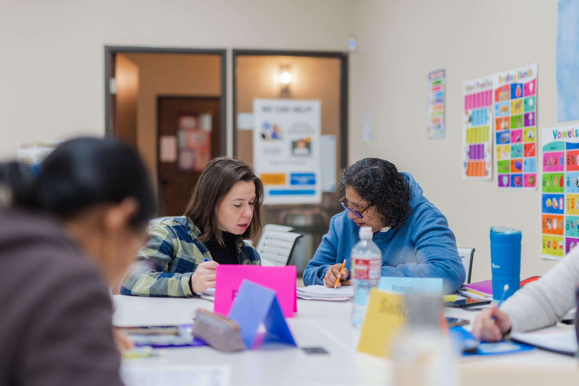 Adult students working together in a Restore Education classroom