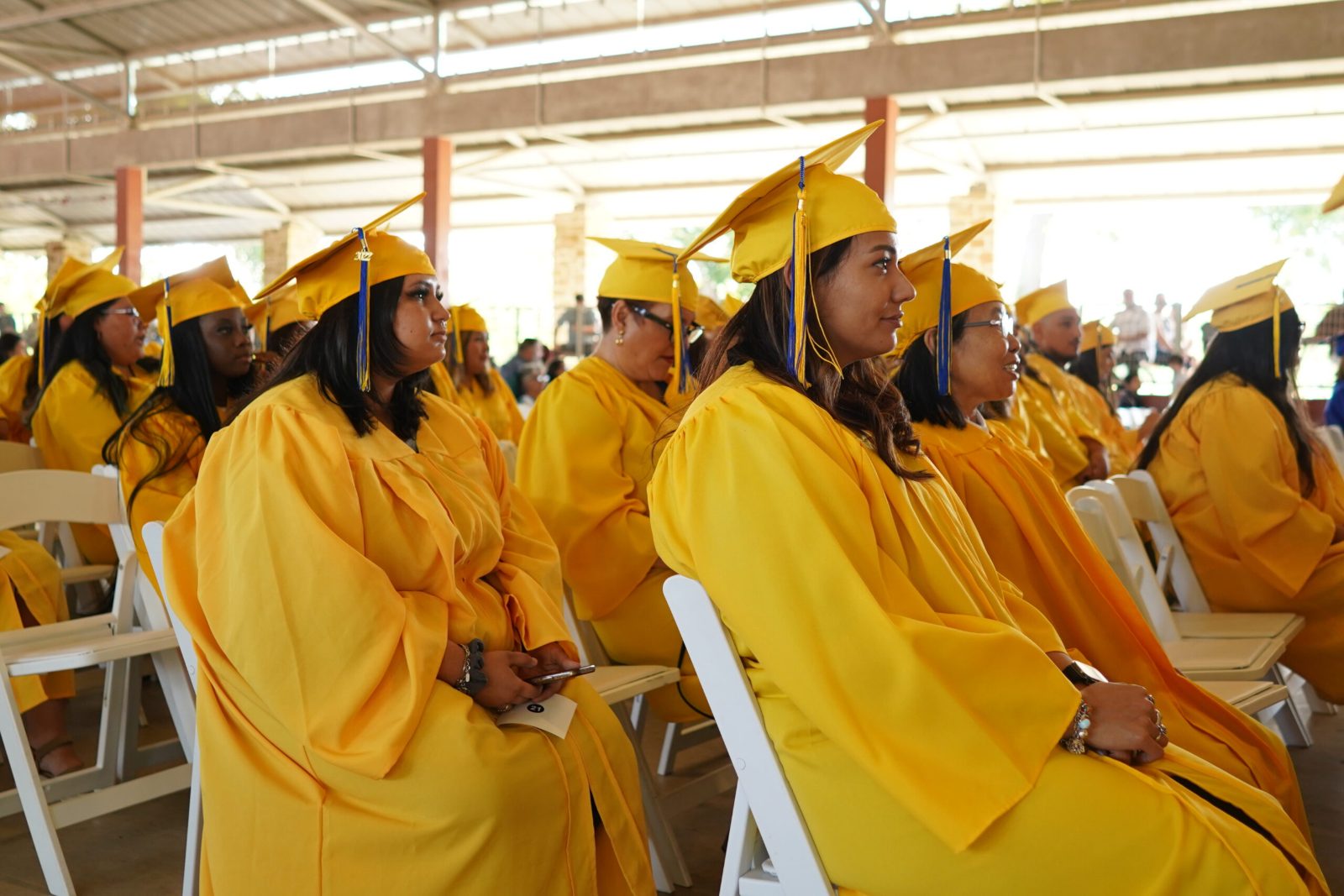 Restore Education graduates in caps and gowns